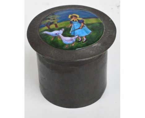 Attributed to LIBERTY & CO; an Arts and Crafts hammered pewter and enamel decorated cylindrical tea caddy and cover, the lift