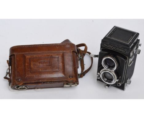 A vintage Zeiss Ikon leather cased camera with a filter, and a Minolta Autocord camera (2).