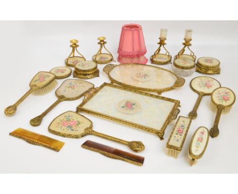 A matched set of various petit point needlework decorated dressing table items to include brushes, hand mirrors, a trinket bo