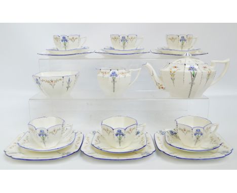 A Shelley tea service decorated in the 11561 pattern, comprising teapot, six cups, seven saucers, a single side plate, jug an