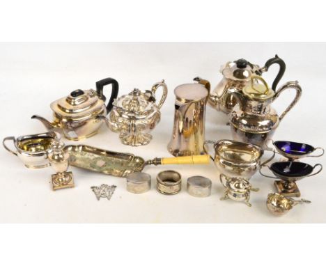 A quantity of silver plated items including embossed teapot, two hot water jugs, various cruets, napkin ring etc.