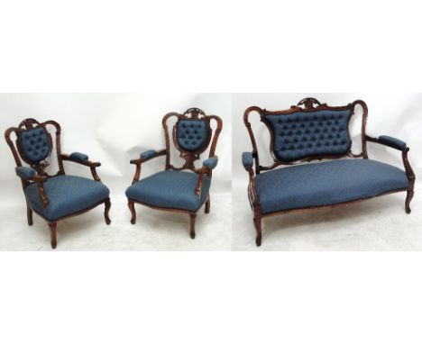 An Edwardian walnut framed three piece parlour/salon suite with blue button upholstery and square section cabriole legs.