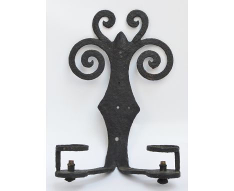 A wrought iron wall mounted two sectioned light with scrolling back plate, length 33cm.