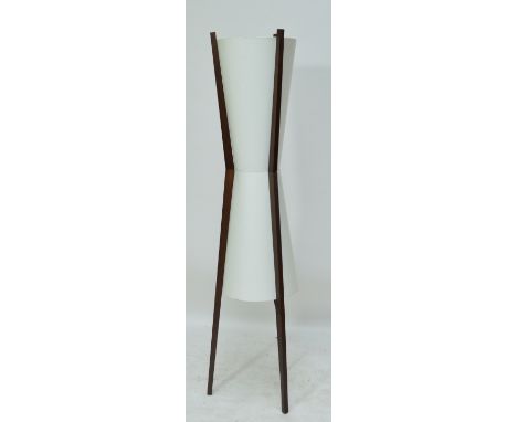 A tripod standard lamp of waisted circular form, height 183cm.