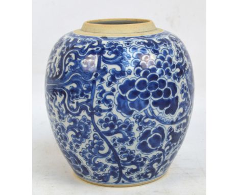 A 19th century Chinese ginger jar overall painted in underglaze blue with two phoenix amongst floral and scroll sprays, beari