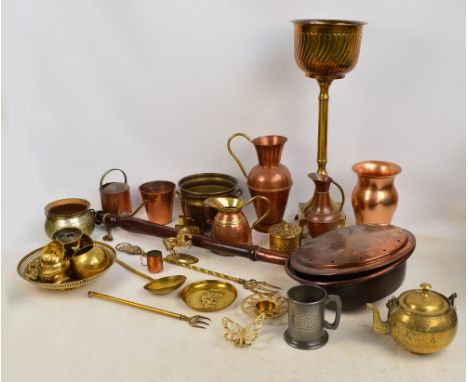 A group of metalware including a copper warming pan, a baluster jug, a brass teapot, jardinière on stand, a small cauldron, h