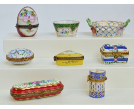 A group of six French Limoges porcelain trinket boxes including a cylindrical example with thistle shaped clasp, an egg shape