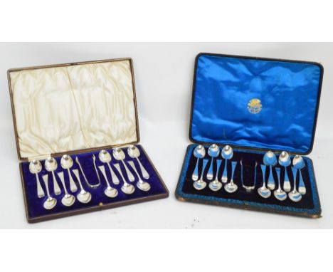 A cased set of twelve Edward VII hallmarked silver teaspoons with bright cut stems and initialled finials with matching sugar