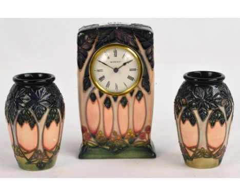 A pair of small modern Moorcroft ovoid vases in Clooney pattern, with impressed marks to base, height 11cm, and a Moorcroft m