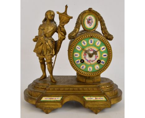 A French gilt metal mantel clock, the circular enamel dial set with Roman hour markers, the eight day drum movement by Japy F