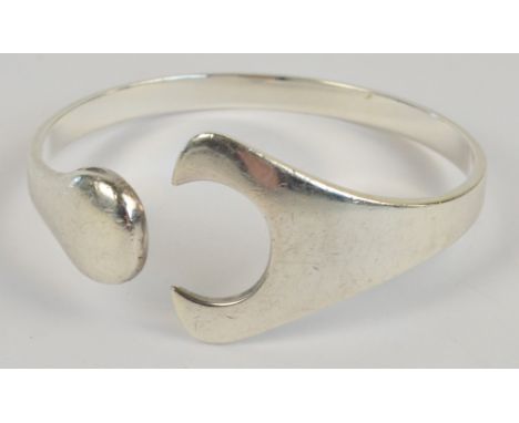 GEORG JENSEN; a silver "Puzzle" bangle designed by Hans Hansen, boxed. CONDITION REPORT: Generally very good condition. Trace