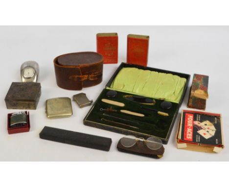 An early 20th century cased part manicure set, a leather cased brush, a pair of cased spectacles, a boxed razor, an electropl