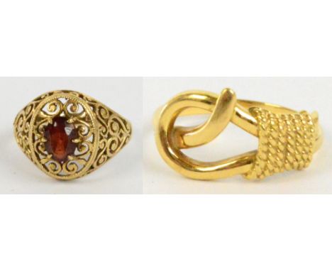 An 18ct yellow gold rope twist decorated ring, size N, approx 4.9g, and a 9ct gold pierced dress ring, size M½, approx 2.7g (