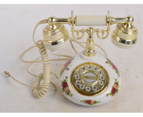 A Royal Albert "Old Country Roses" pattern ceramic phone with simulated rotating dial, height 18.5cm.