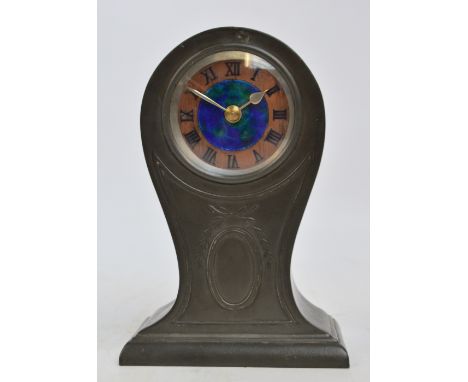 A Liberty & Co pewter balloon shaped mantel clock, the blue/green enamelled central roundel within a "copper" chapter ring se