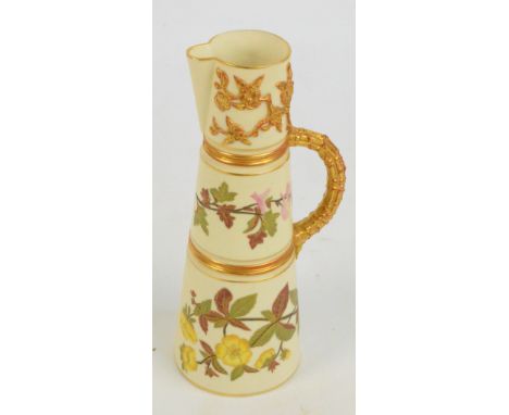 A Royal Worcester ivory porcelain jug of sectional tapering form, hand painted and gilt heightened with floral sprays, with a