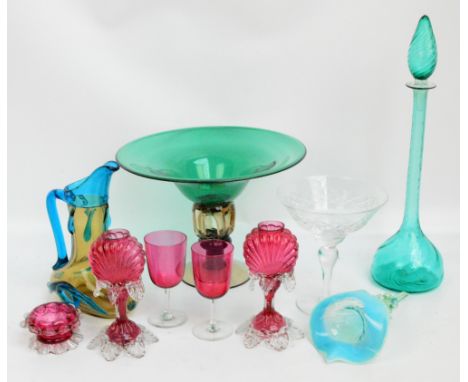 A small collection of mostly coloured glass including a large green tazza with pierced stem, a decorative amber and blue jug,