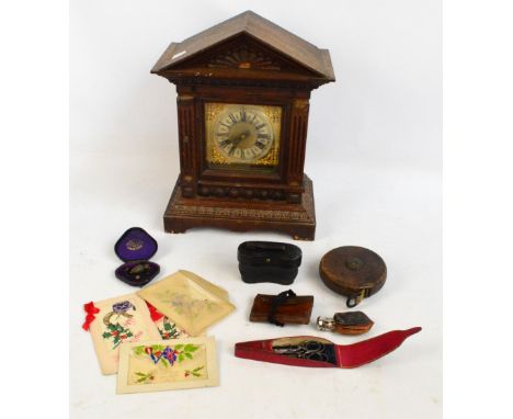 A collectors' lot including a mantel clock, a pair of opera glasses, a propelling pencil in the form of an acorn, a purse, et