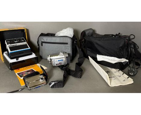 A selection of cameras and camera equipment to include a Kodak EK4 instand camera, a Panasonic 3CCD video camera and a Prakti