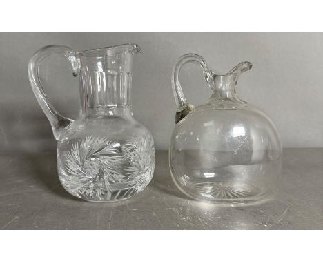 A vintage cut glass "pinwheel" pitcher and a gourd shaped jug 