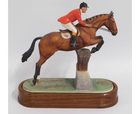 A Royal Worcester porcelain horse & rider group titled 'Fox Hunter & Lt. Col. H.M. Llewellyn CBE, 12in high