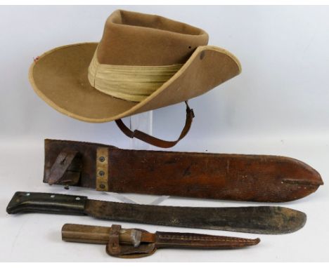 A WWll British tropical slouch hat, by Hall and Phillips Ltd date 1942, a machete, the leather scabbard marked Oliver Webb an