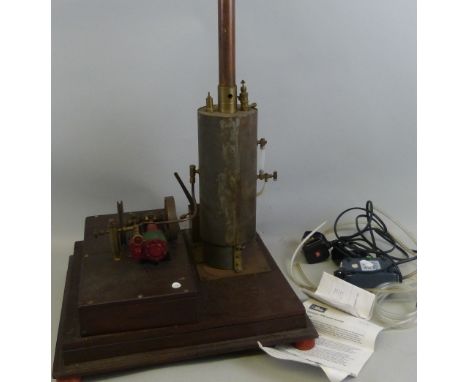 A scratch built stationary steam plant, the vertical steel boiler with copper and brass chimney, powering a horizontal beam e