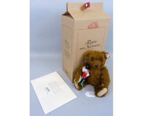 A Steiff limited edition Teddy Bear with Nutcracker, No.2413/3000, 26cm high, boxed with certificate