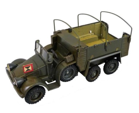 A Lineol tin-plate clockwork model of a WWll three-axled troop carrying truck, rubber tyres marked Lineol (one spare tyre rep