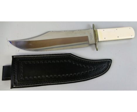 A bowie knife, the 28cm steel blade inscribed J.E. Middleton and Sons Rockingham Street Sheffield with German silver cross-pi