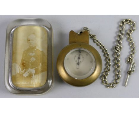 A WWll Dennison nickel cased stop watch, inscribed 1/10 Sec. VC/2534 with watch chain in trench art brass outer case with bev