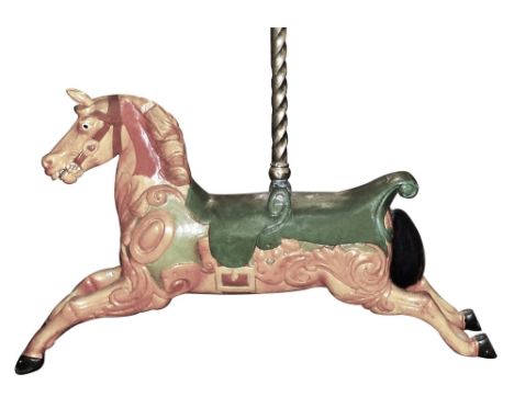 An early 20th century carved wooden and polychrome painted fairground carousel horse with two seats, inset glass eyes, horse 