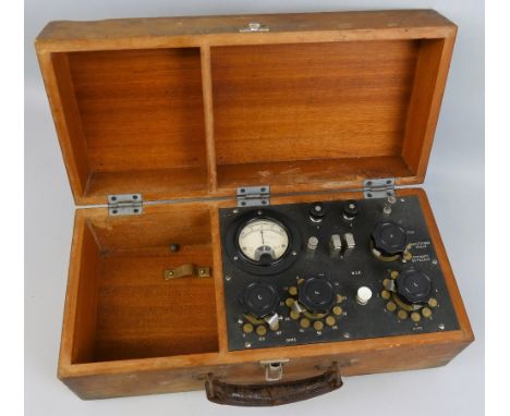 A British Army Wheatstone Bridge detonator in mahogany box 41cm wide