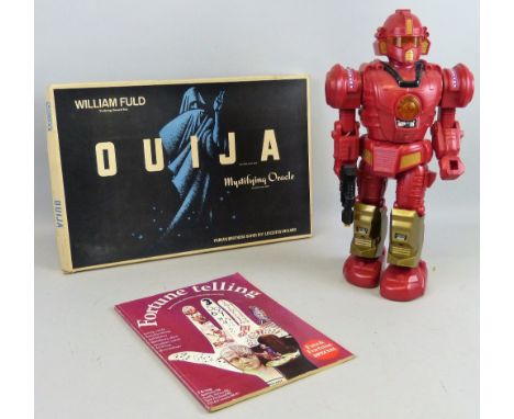 A Chad Valley Chinese plastic battery operated robot, 43cm high and a Parker Ouija board set (2)