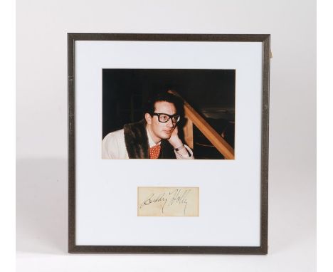 Buddy Holly autograph, with a photograph of Buddy Holly above the signed slip