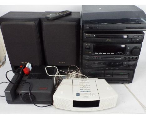 A Bose Wave Radio / CD music system, and Aiwa stereo system and turntable, also includes a Hanimex slide projector.