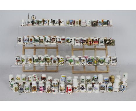 A collection of thimbles to include ceramic, cloisonne, metal. [2]