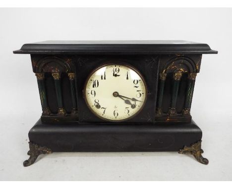 An early 20th century Gilbert faux slate mantel clock of architectural form.