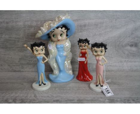 Four boxed Wade ceramic Betty Boop figurines to include a large example, all with COA's