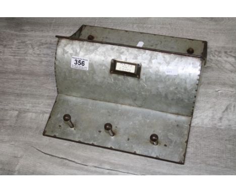 Galvanized Industrial hopper with hanging pegs beneath