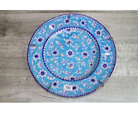 Large Iznic style ceramic Charger with Floral decoration on blue ground