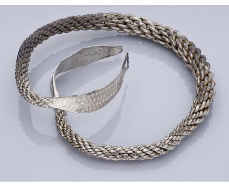 Medieval, Viking, A silver neck or armlet ring, 10th century, 71.28g, 9.4cm diameter by 1cm thick; multiple twisted rods brai