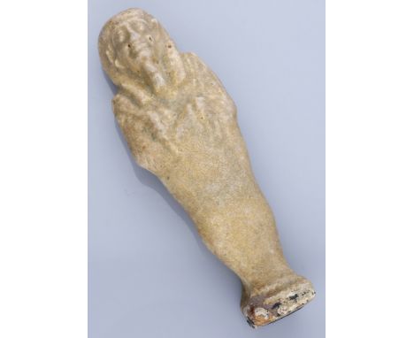 Egypt, Late Period (664-332 BC), 30th Dynasty, glazed pale cream/green faience uninscribed shabti; wears tripartite wig and l