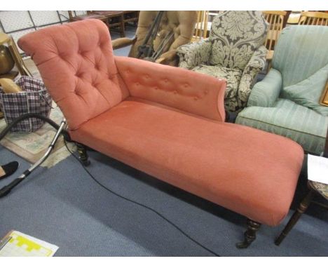 A Victorian terracotta velour, button back upholstered chaise longue on mahogany turned legs, 35" h x 63" w 