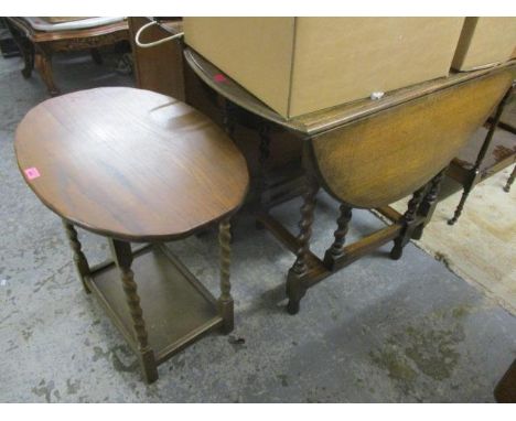 A 1930s oak gate leg table, 28 1/2"h x 35"w, and a two tier oak occasional table, 24"h x 26"w 