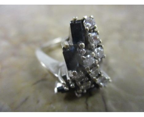 An 18ct white gold diamond and sapphire ring, 9g 