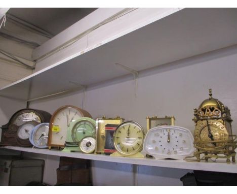 A collection of vintage mantel clocks to include a Smiths Electric green Bakelite clock, together with an oak cased android w