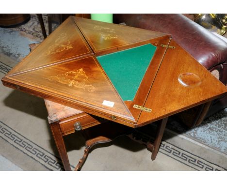 Edwardian mahogany inlaid envelope card table with single drawer and under tier on square tapering supports 