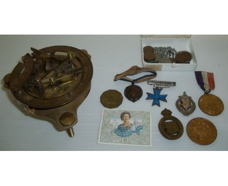 Brass compass with engraved detail on three adjustable screw feet and a Hartlepool School of Nursing silver and enamel bar br