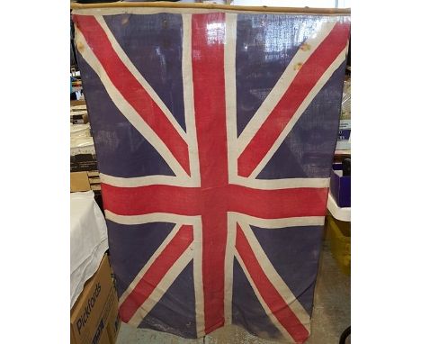 Vintage Union Jack flag on bamboo pole